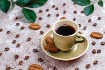 Composition with roasted coffee beans and coffe bean shaped cookies