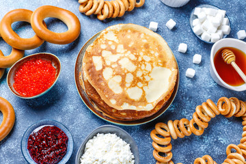 Shrovetide Maslenitsa festival meal. Russian pancake blini with raspberry jam, honey, fresh cream...