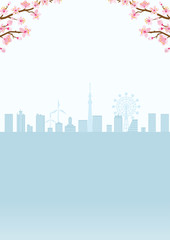 Fototapeta premium Cherry blossom twigs and silhouette of cityscape, vertical layout