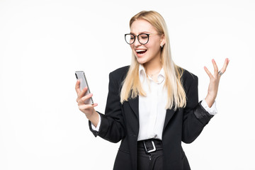 Smiling businesswoman using smartphone over gray background.