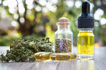 Glass bottles containing CBD hemp oil and drugs extracted from researchers or medical team hemp oil...