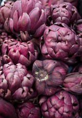 Fresh colourful artichokes, stacked