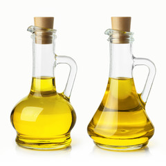 Set of glass bottles with delicious oil, isolated on white