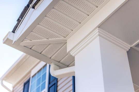 Colonial white custom porch columns with wood looking vinyl column wrap, sheets and molding, white soffit provides optimal ventilation for roof overhangs 
