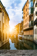 Fototapeta na wymiar Romantic landmark street cityscape with tourist attraction small lovely town village in Europe italy with narrow ally old historical architecture houses buildings background with canals and bridge