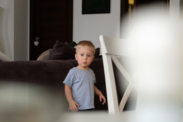 Portrait of a little blond boy with blue eyes