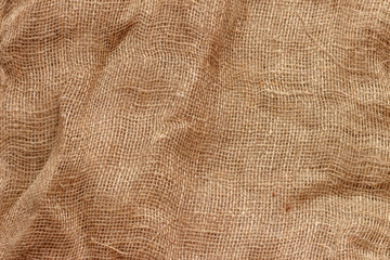 Crumpled fabric - natural unpainted burlap.