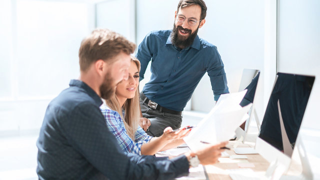 employees discussing documentation for a new project