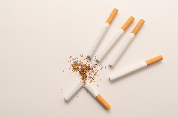 Broken cigarette on white background, World No Tobacco Day. Lung health concept.