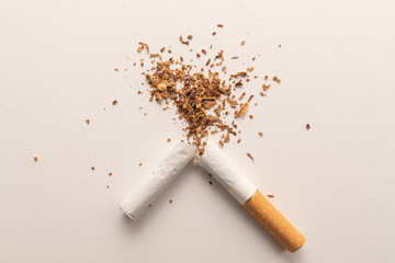 Broken cigarette on white background, World No Tobacco Day. Lung health concept.