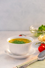 Fragrant and delicious chicken soup with herbs and vegetables.