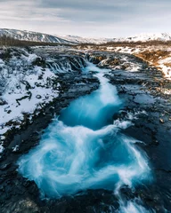Rolgordijnen Bruarfoss Waterfall in winter. Beautiful landscape of breathtaking Iceland that is worth it to visit all year long. Tourism in Iceland has its boom because of the unforgettable gorgeous scenery © Marek