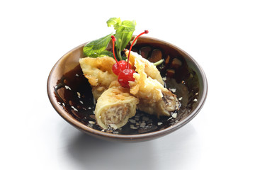 Banana in tempura. Oriental dessert isolated on white.