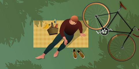 A young cyclist resting on a picnic blanket. Top view. Summer city park. Flat graphic vector illustration.