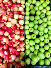 Many apples on street market counter