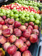 Many apples on street market counter