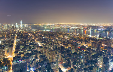 Fototapeta premium Night aerial view of Midtown Manhattan skyscrapers from a high viewpoint, New York City, USA