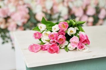 Tulips on floral background on flowers festive background, pastel and soft bouquet floral card. Spring Greeting Card Template. Copy Space. Wedding scene. Mothers Day,female card