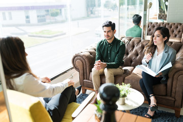 Applicants Sitting With Recruiter At Office