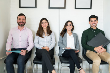 Candidates Sitting In Waiting Room At Office
