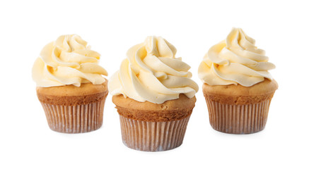 Delicious birthday cupcakes decorated with cream on white background
