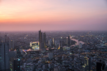 Fototapeta na wymiar Aerial view of Bangkok city at sunset, from Mahanakhon SkyWalk, Thailand, Asia