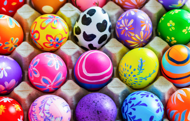 Fototapeta na wymiar Colorful eggs for Easter on the background