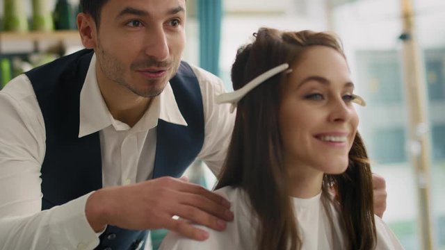 Handheld view of hairdresser giving woman good advice. Shot with RED helium camera in 8K