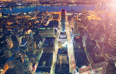 New York City, USA. Night aerial view of Midtown Manhattan skyscrapers from a high viewpoint