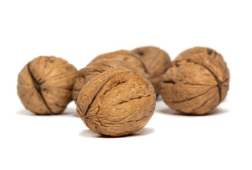 Delicious whole walnuts isolated on a white background