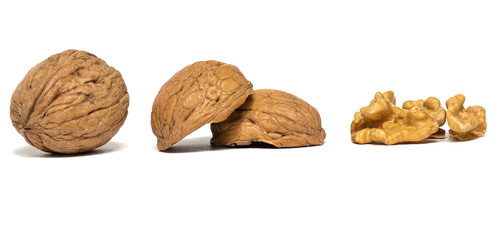Delicious whole and broken walnuts, isolated on white background