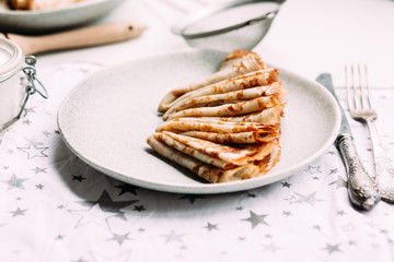 Pancakes with wild berries in a plate.Maslenitsa