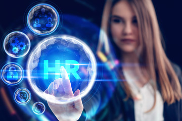 Business, Technology, Internet and network concept. Young businessman working on a virtual screen of the future and sees the inscription: HR