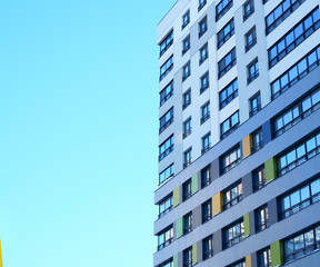 High-rise building in a modern style. Residential, office building in the city metropolis. Comfortable housing for the active population. Concept: VIP class.