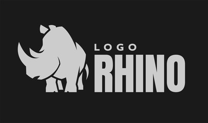 African rhino silhouette. Logo, symbol on a dark background. Vector illustration. © makstrv