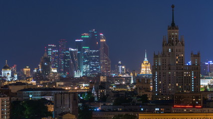 Fototapeta na wymiar Stalin skyskrapers night timelapse, Moscow International Business Center and panoramic view of Moscow