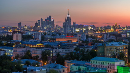 Skyscrapers day to night timelapse, Kremlin towers and churches, stalin houses at evening aerial panorama in Moscow, Russia