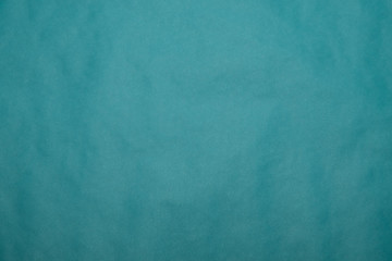 Background from blue paper. Crumpled paper texture. Background, texture of colored parchment paper.