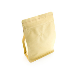 Light brown craft paper bag with coffee grains. Tightly closed with small odor holes. On a white isolated background. Stands upright.