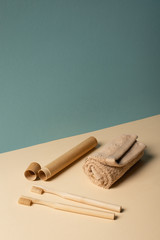 Toothbrushes, toothbrush case, towel on beige and grey, zero waste concept