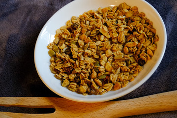 Cereal breakfast with Whole Grain Oats and Dried Strawberry. Tasty and perfect for breakfast, a healthy snack, workout meal or as ice cream toppings. Top view, flat lay.