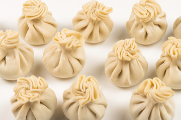 Khinkali on white background.