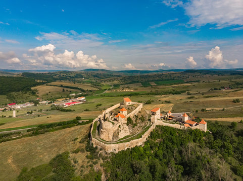 Beautiful aerial view of the Rupea Stronghold on a blue sky with white clouds, Rupea, Brasov, Romania