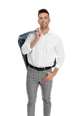 Fototapeta premium Man holding hanger with jacket in plastic bag on white background. Dry-cleaning service