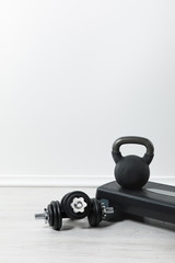 Fototapeta premium step platform, dumbbells and kettlebell at home