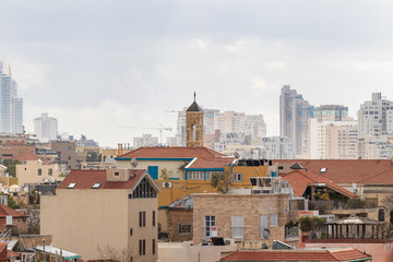 Fototapeta na wymiar The combination of old and new buildings in Yafo in Israel
