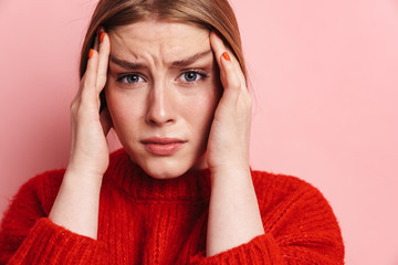 Photo of unhappy woman with headache posing and looking at camera