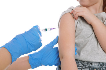 Obraz na płótnie Canvas Little girl receiving chickenpox vaccination on white background, closeup. Varicella virus prevention