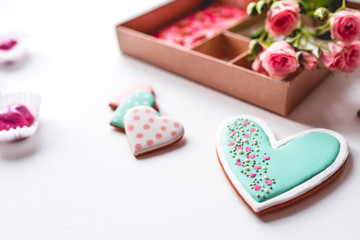 Fototapeta premium Gift set with hand made sweets in a box on a white table. Flat lay, top view.