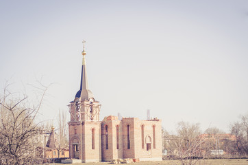 Obraz premium construction of a new red brick church